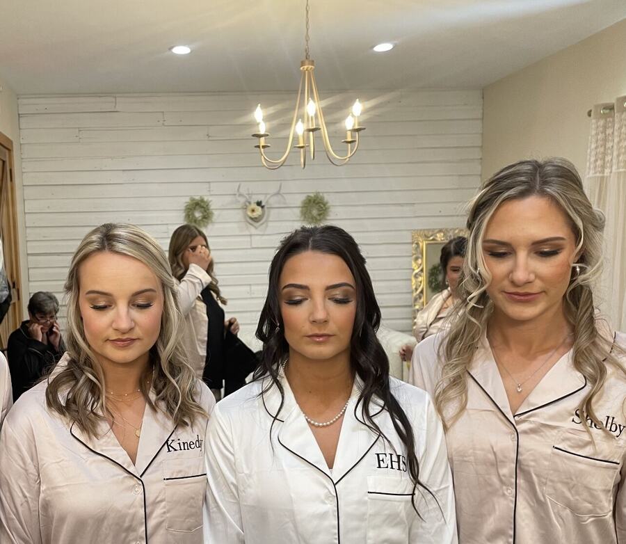 Bridesmaids ready together in matching robes
